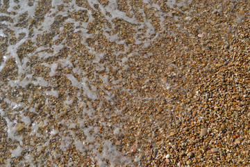 colored stones at the bottom of the sea 