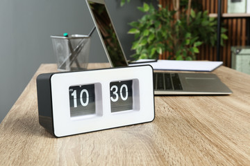 Stylish flip clock on table in office,  space for text. Time management