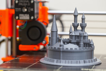 Modern three dimensional printer during work.