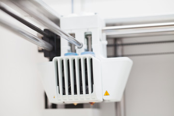 Modern three dimensional printer during work.