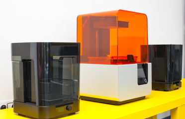 Modern three dimensional printer during work.