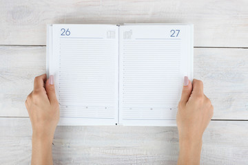 Open diary in hand