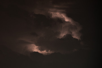 Fototapeta na wymiar black rain clouds and lightning 