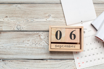 September 6. Image of September 6 wooden calendar on wooden background . Autumn day