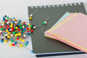 Sticky notes and pushpins on white background. School concept.