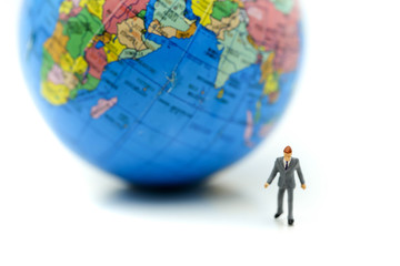 Miniature people : Businessman with mini world using for concept of International Men's Day.