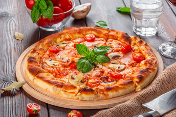 Delicious fresh pizza served on wooden table