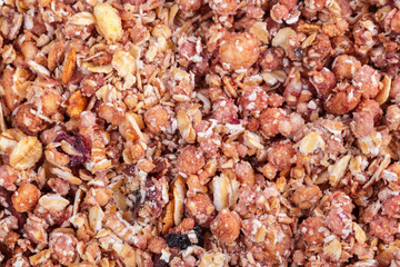 Organic homemade Granola Cereal with oats and almond. Texture oatmeal granola or muesli as background.