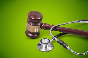 Gavel and stethoscope on background, symbol photo