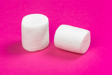 marshmallows on a pink background. top view