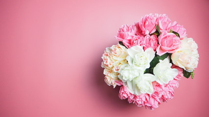 Rose flowers are on a pink background. Valentines Day Background.