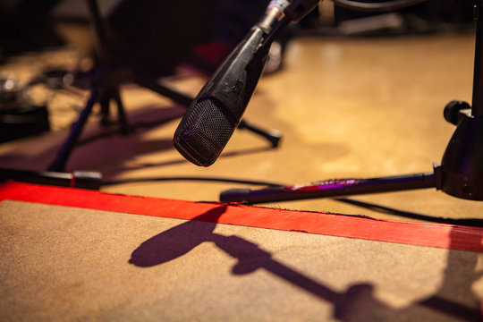 feet tapping microphone on a stage - Closeup picture taken at a storytelling and folk music festival in Quebec, Canada