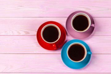 Coffee time. Bright colored composition of coffee cups