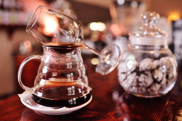 glassware for brewing and making coffee close-up against the background of a coffee house