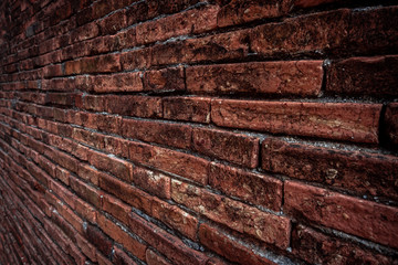 Brown brick wall texture grunge background with vignetted corners, may use to interior design