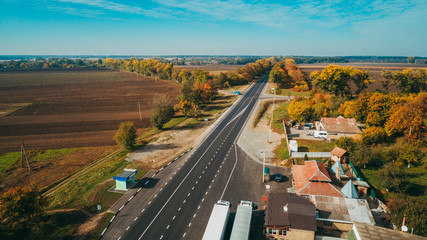 Fototapeta premium Aerial view of the new road in Ukraine. Autumn. Road marking.