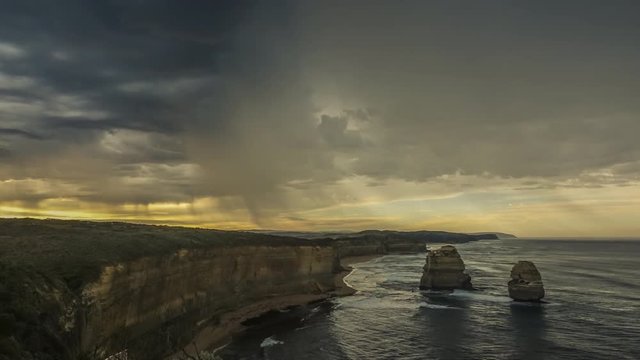 Timelapse of stormy clouds with heavy rain on Australian coast near Twelve Apostles, major tourist attraction on Great Ocean Road in Victoria, Australia.