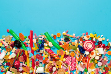 colored candies on blue background