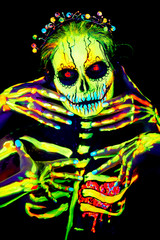 Fototapeta na wymiar UV body art painting of helloween female skeleton Día de los Muertos