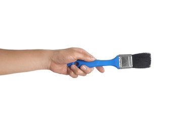 Paintbrush in male hand isolated on white