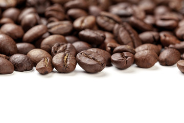 Pile coffee beans isolated on white background