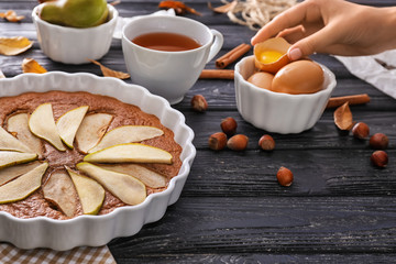 Delicious pear cake on wooden table