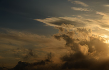 Obraz na płótnie Canvas Dramatic sunset sky with dark clouds.