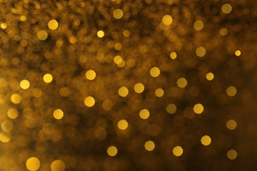 Blurred view of golden glitters