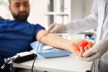 Man donating blood in hospital