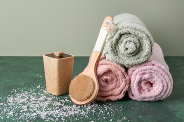Composition with rolled clean towels on table