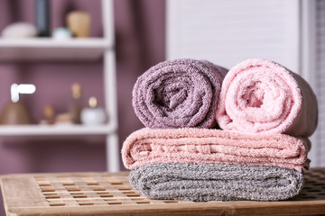 Obraz na płótnie Canvas Clean soft towels on table in bathroom