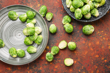 Plates with fresh brussels sprouts on table, top view