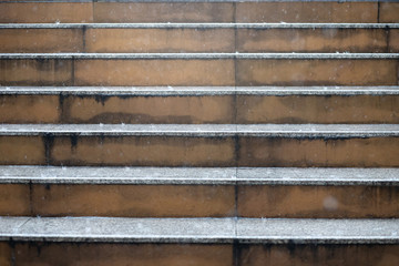 Close up of a staircase steps Rain drops in the water heavy wet During the rainy season, rustic look. Concrete going up looking railing. Architectural stairway in the city. landmarks wide stone stairs