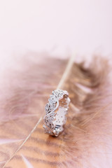 Silver ring in floral design with diamonds