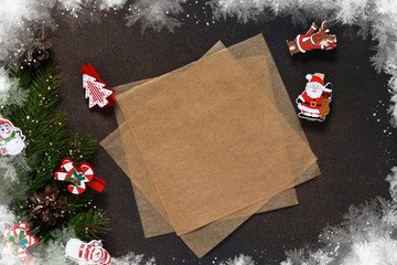 New Year card. Letter for Santa. Christmas tree and decorative clothespins on a brown background with space under the text.