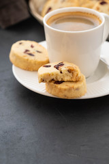 Closeup of cookies and a cup of coffee. Symbolic image. Concept for a tasty snack. Sweet dessert. Selective focus. Close up.