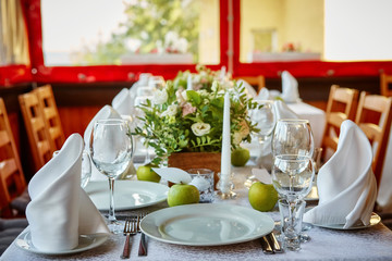 Decorated table for a festive or wedding event, decorated in apple style