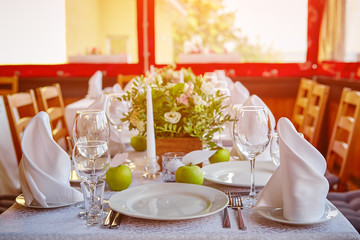 Decorated table for a festive or wedding event, decorated in apple style