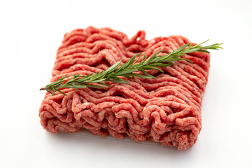 Ground beef and pork with rosemary isolated on white