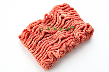 Beef and pork minced with fresh thyme isolated on white