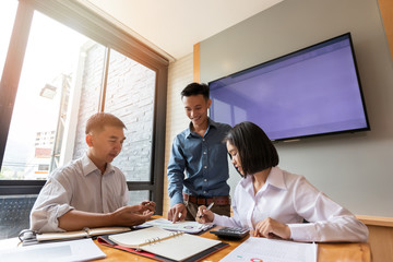 Business team meeting and discussing project plan. Businessmen discussing together in meeting room. Professional investor working with business project together. Finance managers task.