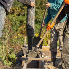 Concreting builders poured fresh, high-quality concrete close up