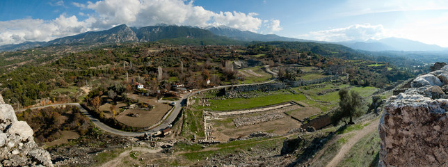 Panorama overlooking the mountains and the old town and bright blue sky