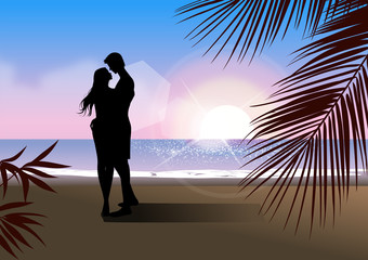 Silhouette of a couple embracing each other on the beach