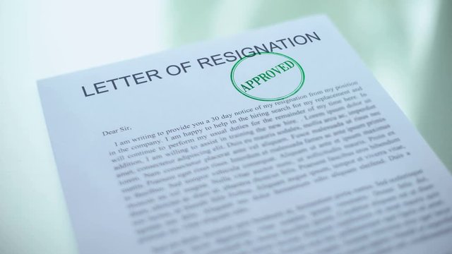 Approved letter of resignation, hand stamping seal on official paper, drawdown