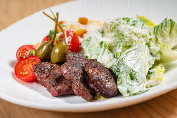 meat with caesar salad