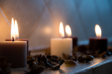 relaxing spa background with candles and some wooden petals