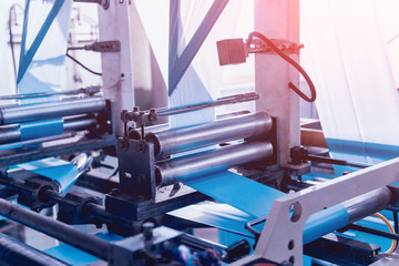 Modern automated production line in factory. Plastic bag manufacturing process