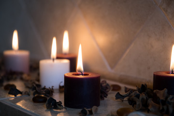 relaxing spa background with candles and some wooden petals