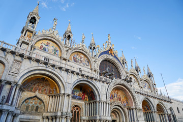 Fototapeta na wymiar Venice, San Marco basilica facade, blue sky in Italy